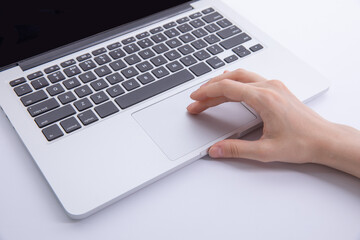 top view of female hand typing on laptop keyboard, work concept . High quality photo