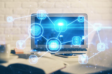 Computer on desktop with social network hologram. Multi exposure. Concept of international people connections.