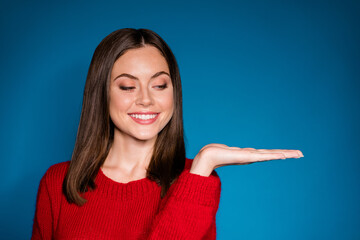 Close-up portrait of her she nice-looking attractive pretty cheerful girl holding on palm copy space solution offer promo promoter advice ad isolated bright vivid shine vibrant blue color background