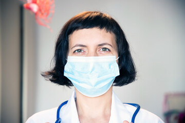 Doctor wearing protection face mask against coronavirus.