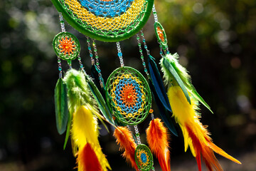 Obraz premium Handmade dream catcher with feathers threads and beads rope hanging