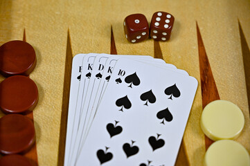 backgammon board with game pieces cards and dices