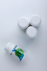 Plant fertilizer bottles on white background
