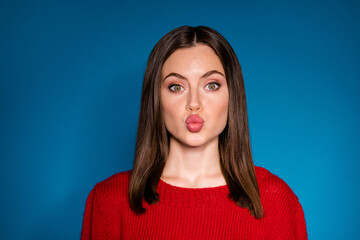 Fototapeta premium Close-up portrait of her she nice attractive charming pretty lovable lovely amorous brown-haired girl sending air kiss isolated bright vivid shine vibrant blue color background