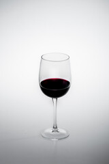 A glass of wine on white background