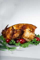 A backed chicken with alcohol on white background