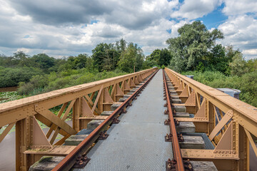 The Moerputten Bridge is a former Dutch railway bridge. The bridge was in use as railway bridge from 1887 until 1972. Currently the restored bridge is a footpath through and above a nature reserve.