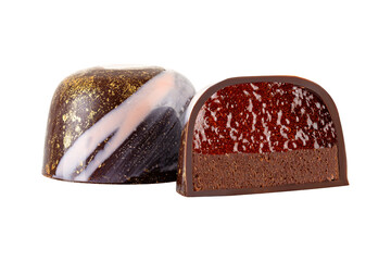 Cut luxury handmade bonbon with chocolate cream and fruit filling isolated on white background