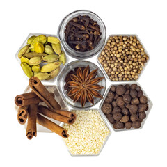 Spices in hexagonal jars isolated on a white background