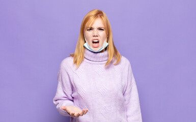 pretty woman  looking angry, annoyed and frustrated screaming wtf or what’s wrong with you