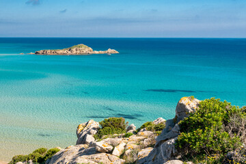cristal clear water and white sand in Su Giudeu beach, Chia, Sardinia