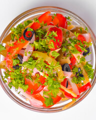 Healthy food - mix vegetable salad served in a bowl over white background. Healthy eating, delicious snack or dinner.