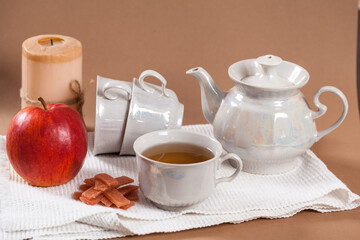 A cup of tea and various types of pastila on a white cloth