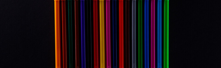 collection of colorful felt-tip pens on dark background, close view. High quality photo