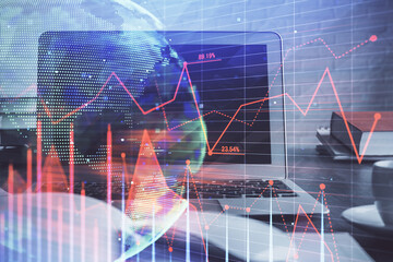 Financial market graph hologram and personal computer on background. Multi exposure. Concept of forex.
