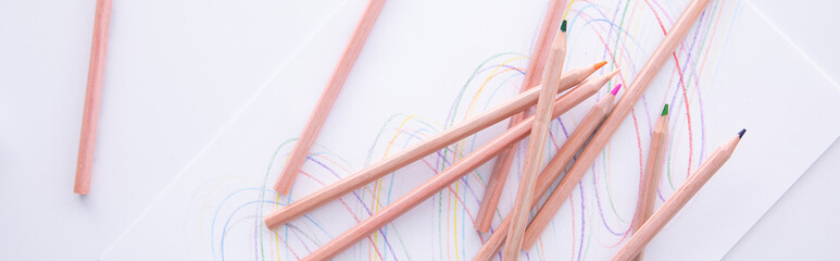 Fototapeta premium collection of wooden colorful pencils with drawing isolated on white background, close view. High quality photo