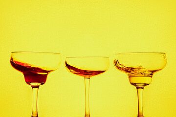 
splash cocktails on neon background  