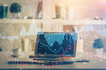 Forex market graph hologram and personal computer on background. Multi exposure. Concept of investment.