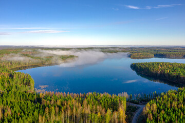 Finland landscape from the air with drone, lakes and pine forest