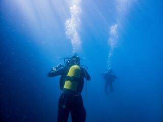 Scuba diver in blue ocean