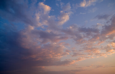 Naklejka na ściany i meble Dramatic sunset sky with colored clouds. Toned image.