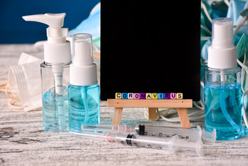A set of hygiene products to prevent the coronavirus, and a black board for writing messages.