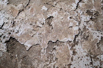 Texture of an old concrete wall, with potholes