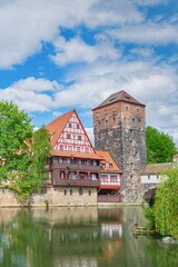 Fototapeta na wymiar German architecture and Pegnitz river. Old fachwerk house. Nuremberg, Bavaria, Germany