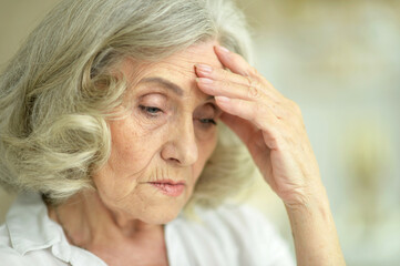 Fototapeta premium Close-up portrait of beautiful sad senior woman