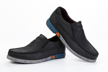 A pair of classic black men's shoes on a white background