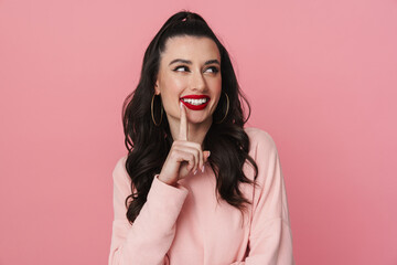 Happy young woman in casual wear standing