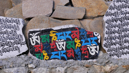 Pile of Buddhist mani stones (carved or inscribed mantra, religious prayers), part of Sherpa...