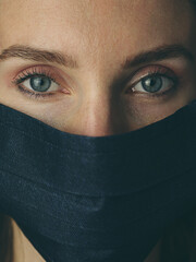 Fototapeta premium Closeup portrait of a woman wearing mask. Quarantine concept