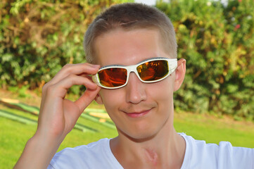 young boy in black glasses, posing, vacation