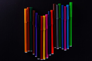 collection of colorful felt-tip pens on dark background, close view. High quality photo