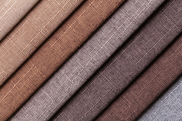 Sample of woven textile brown and gray colors, background.