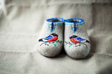 Slippers made of wool,embroidered by the method of felting