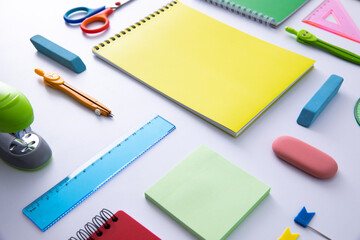 collection of bright colorful stationery on light background, close view . High quality photo
