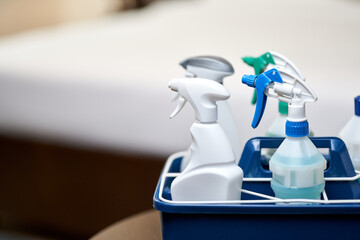 Cleaning bottles for different surfaces in room
