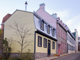 Pretty pastel coloured patrimonial houses in Ferland Street seen from the old town Des Remparts...