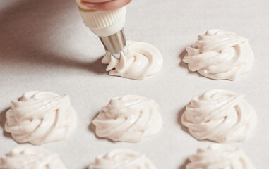 The process of making homemade meringue cookies for the holiday