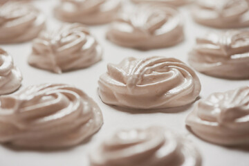 Cooked homemade meringue cookies on baking paper