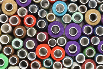 Multicolored sewing thread in spools top view
