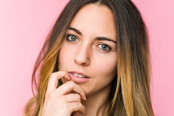 Fototapeta premium Young beautiful woman isolated on pink background