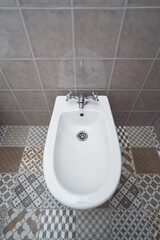 White ceramic bidet with mixer top view