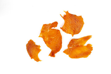 Naklejka na ściany i meble Chicken jerky. dried chicken meat isolated on white background. Beer snack
