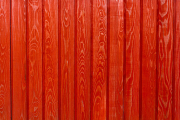 wall made of wooden boards natural wood pine painted in bright red