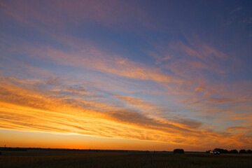 sunset of the red sun on a variegated colored sky