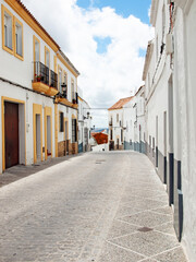 The narrow street with old style white houses in Medina Sidonia. Andalusia,  Spain