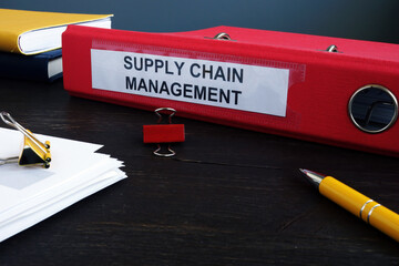 Supply Chain Management SCM papers in the red folder.